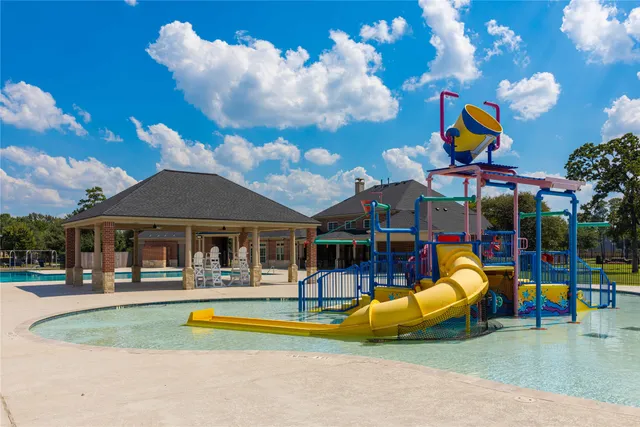 a view of a park with swings and slides