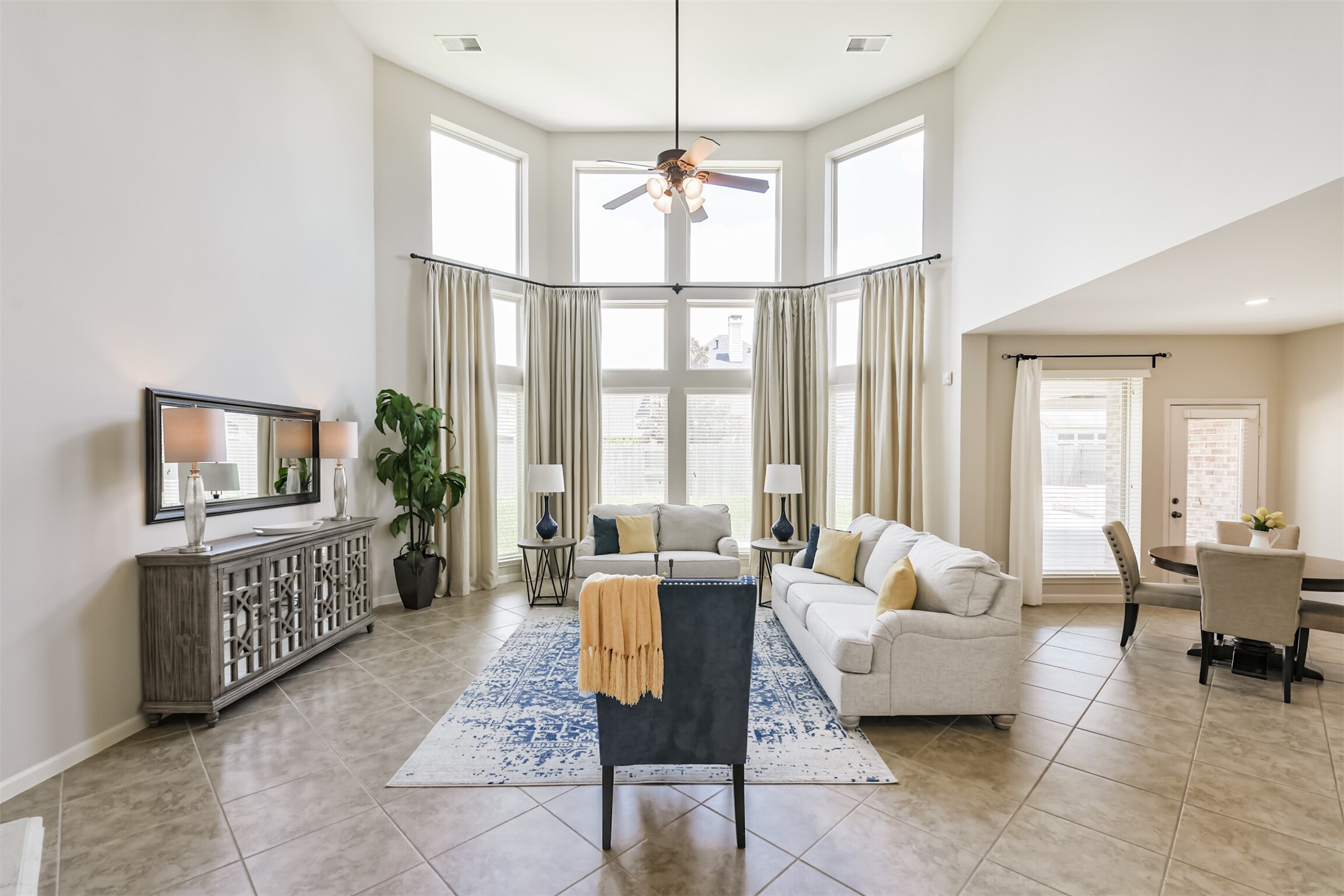 13519 Brant Grove Lane Houston, TX 77044 - Photo 6 of 49 a living room with furniture a flat screen tv and a large window