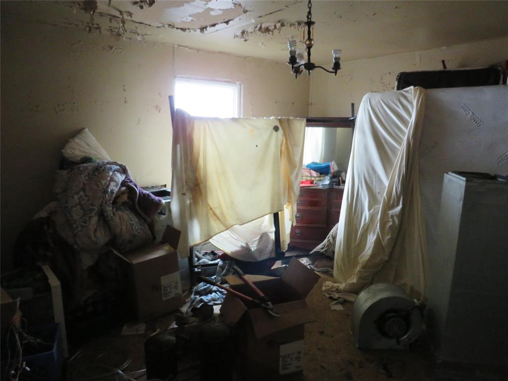 3638 Cleveland Street Dallas, TX 75215 - Photo 9 of 12 a living room with furniture and a window