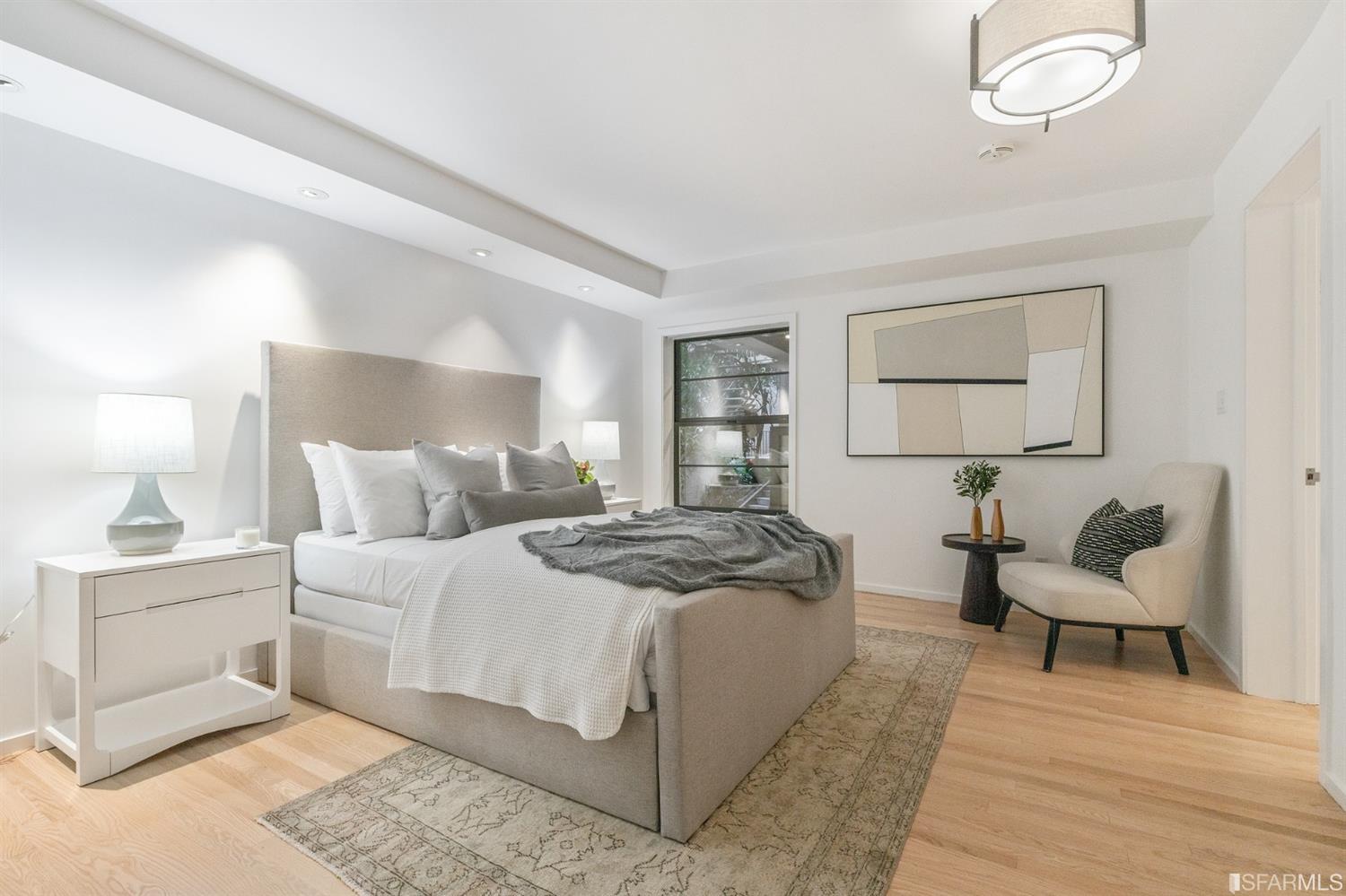 2 Fallon Place, Unit 15 San Francisco, CA 94133 - Photo 18 of 43 a bedroom with a bed and a couch