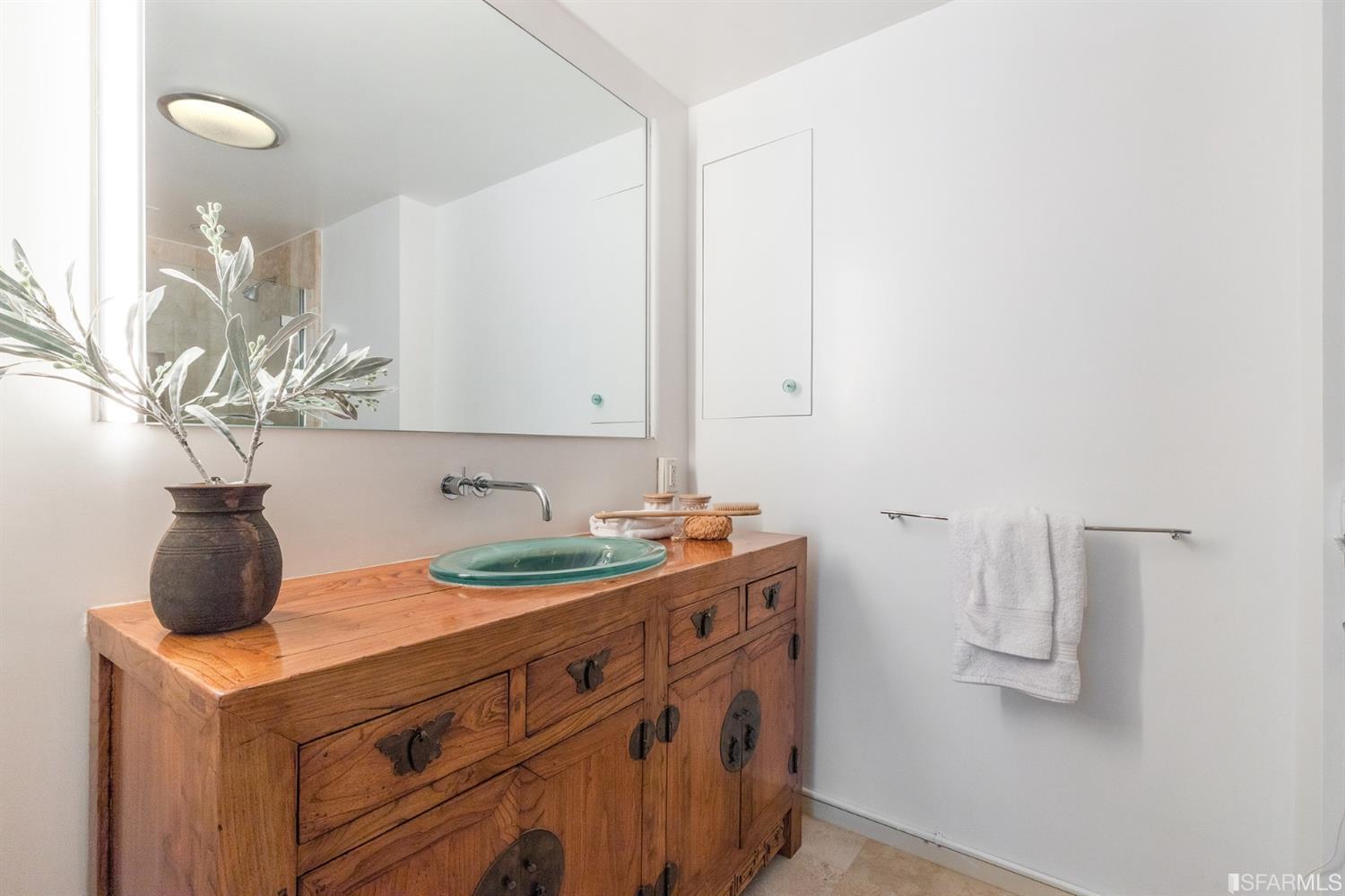 2 Fallon Place, Unit 15 San Francisco, CA 94133 - Photo 20 of 43 a bathroom with a sink and a mirror