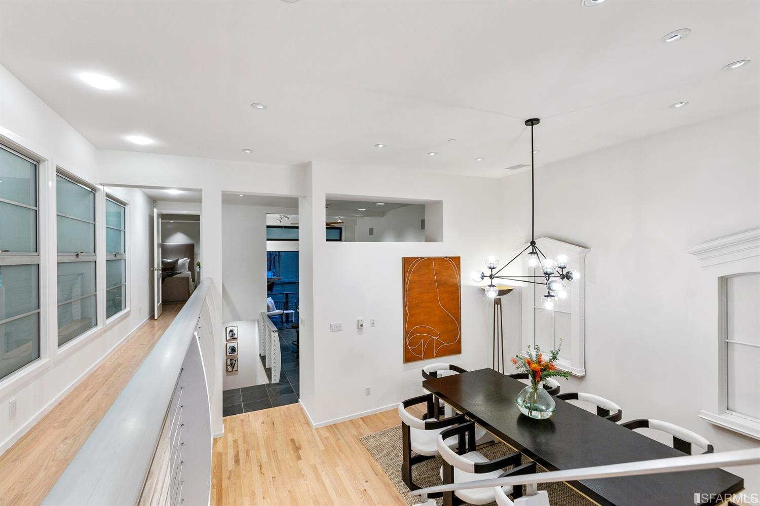 2 Fallon Place, Unit 15 San Francisco, CA 94133 - Photo 21 of 43 a room with furniture a chandelier and a view of kitchen