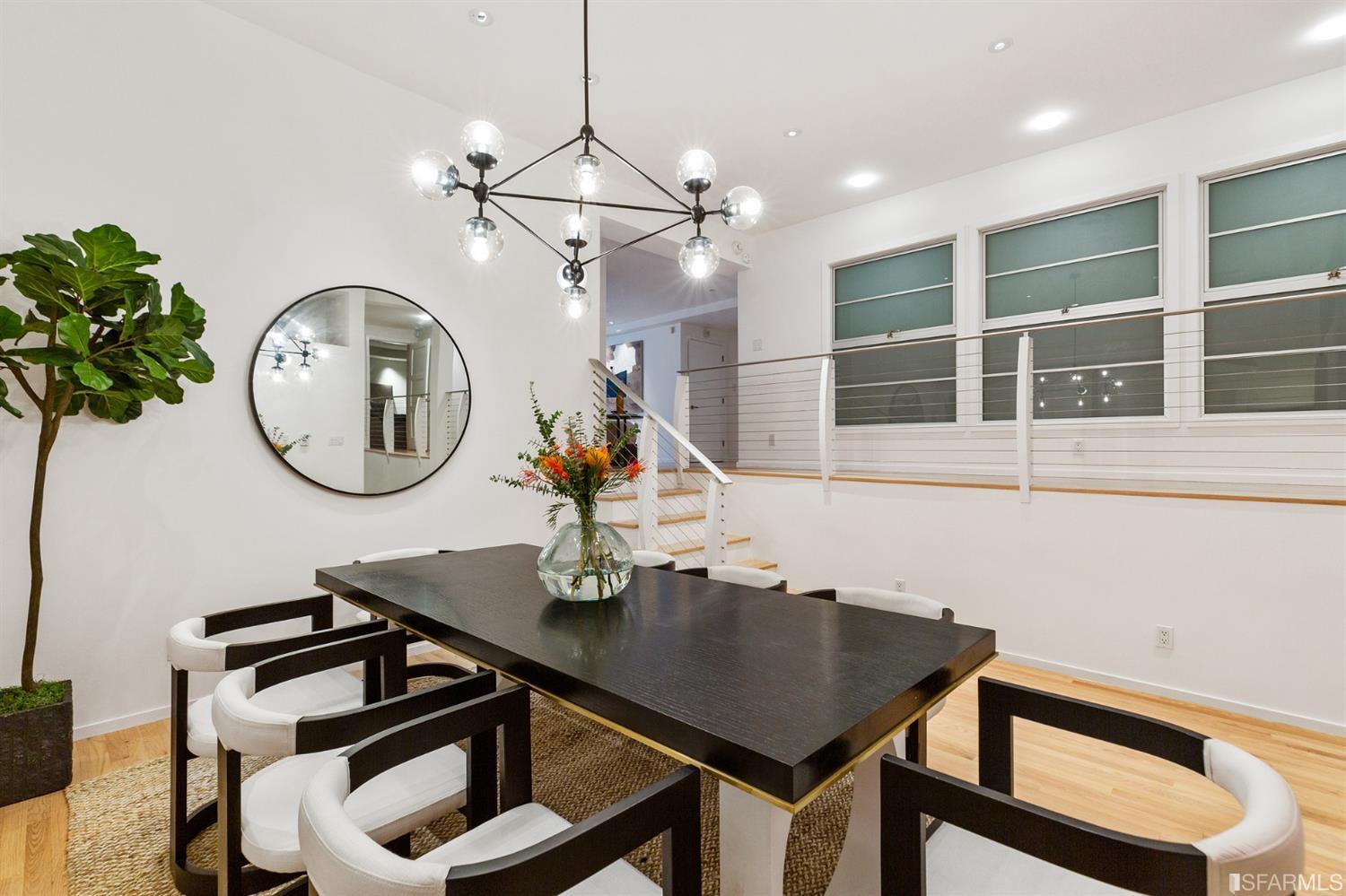 2 Fallon Place, Unit 15 San Francisco, CA 94133 - Photo 23 of 43 a view of a dining room with furniture a chandelier and wooden floor