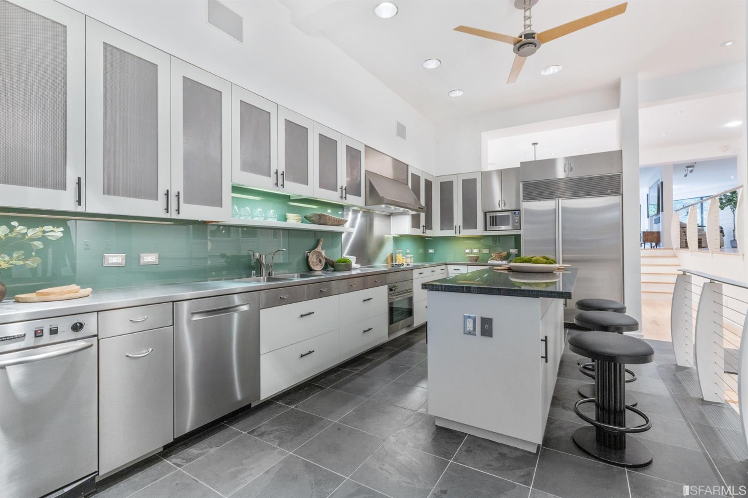 2 Fallon Place, Unit 15 San Francisco, CA 94133 - Photo 25 of 43 a kitchen with granite countertop white cabinets and white appliances