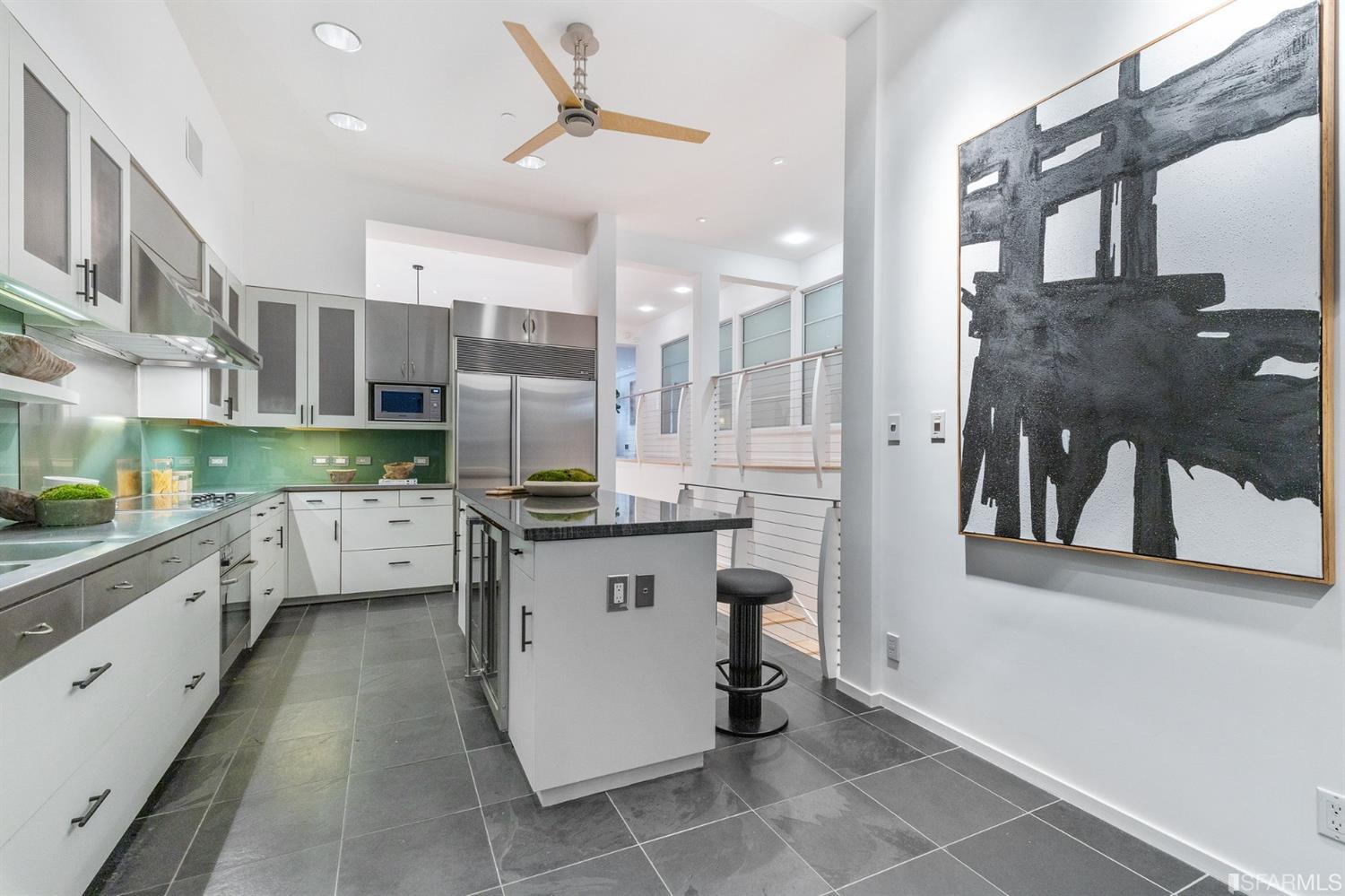 2 Fallon Place, Unit 15 San Francisco, CA 94133 - Photo 27 of 43 a kitchen with stainless steel appliances a sink stove and refrigerator