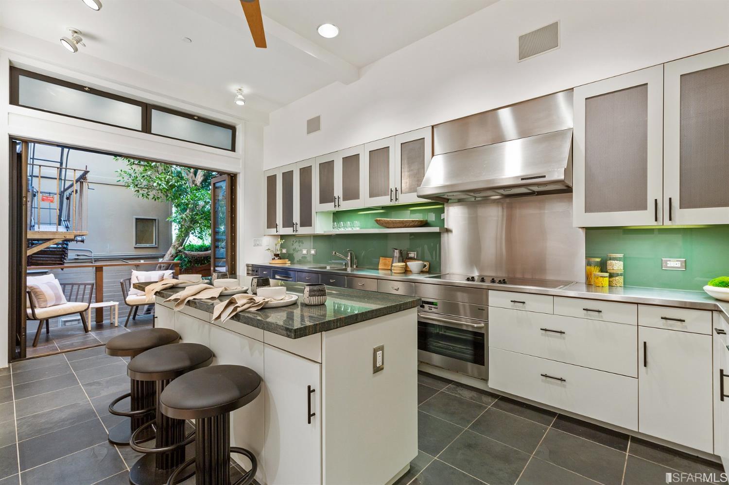 2 Fallon Place, Unit 15 San Francisco, CA 94133 - Photo 28 of 43 a kitchen with a stove a sink and cabinets