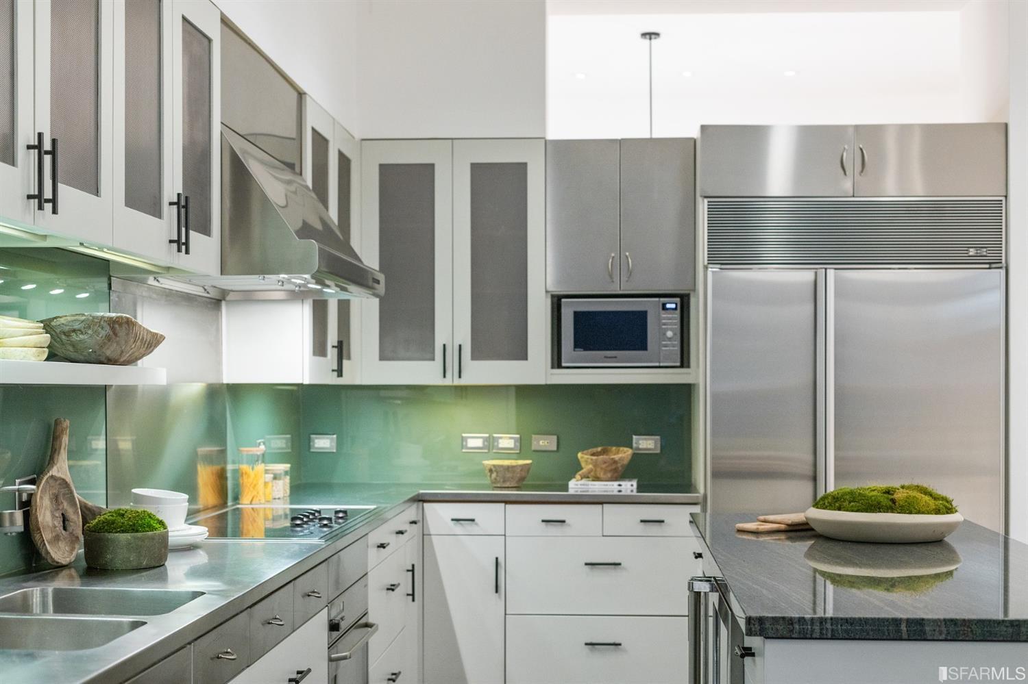 2 Fallon Place, Unit 15 San Francisco, CA 94133 - Photo 29 of 43 a kitchen with stainless steel appliances granite countertop a sink and a white cabinets