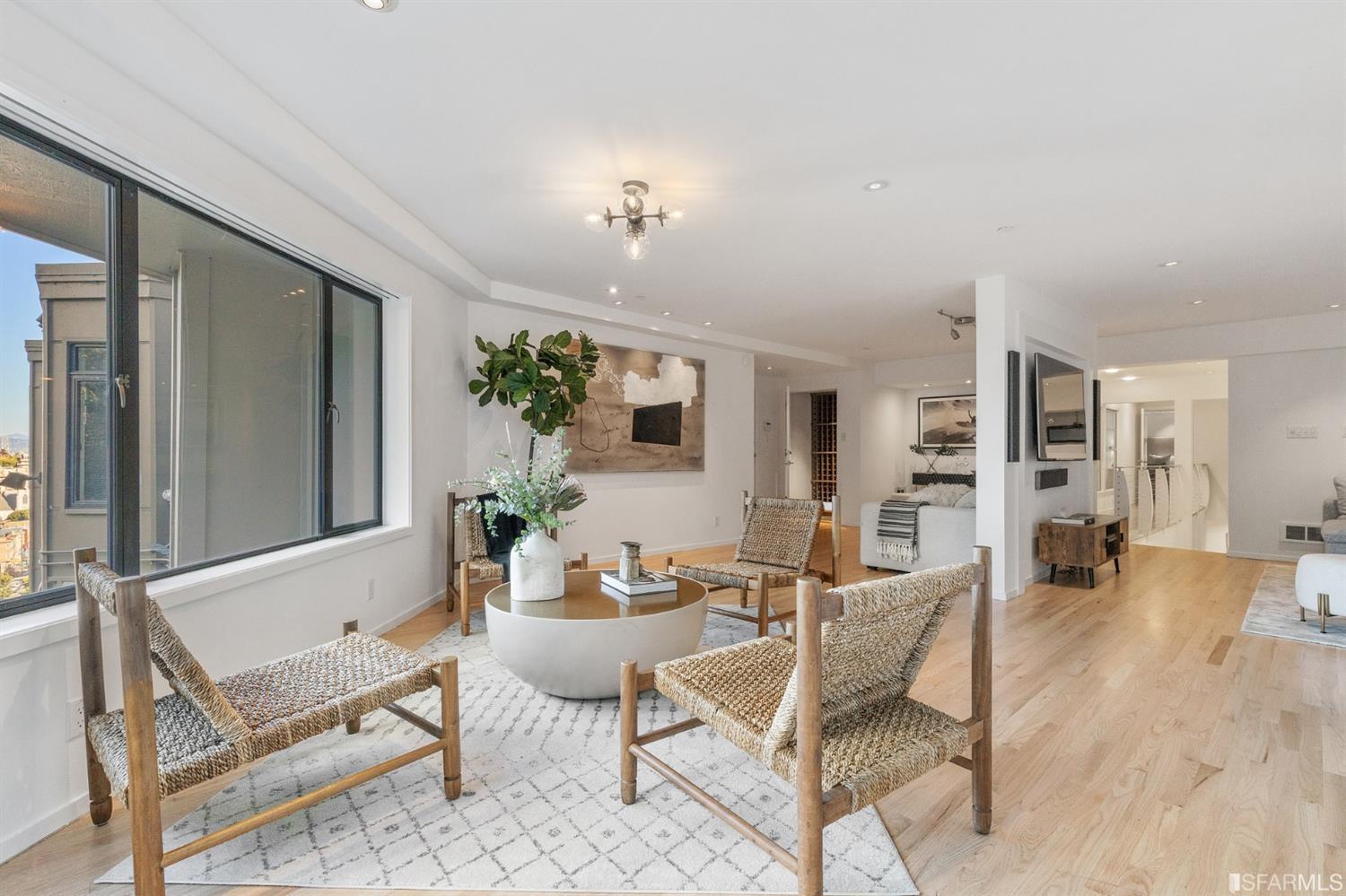 2 Fallon Place, Unit 15 San Francisco, CA 94133 - Photo 3 of 43 a living room with furniture and wooden floor