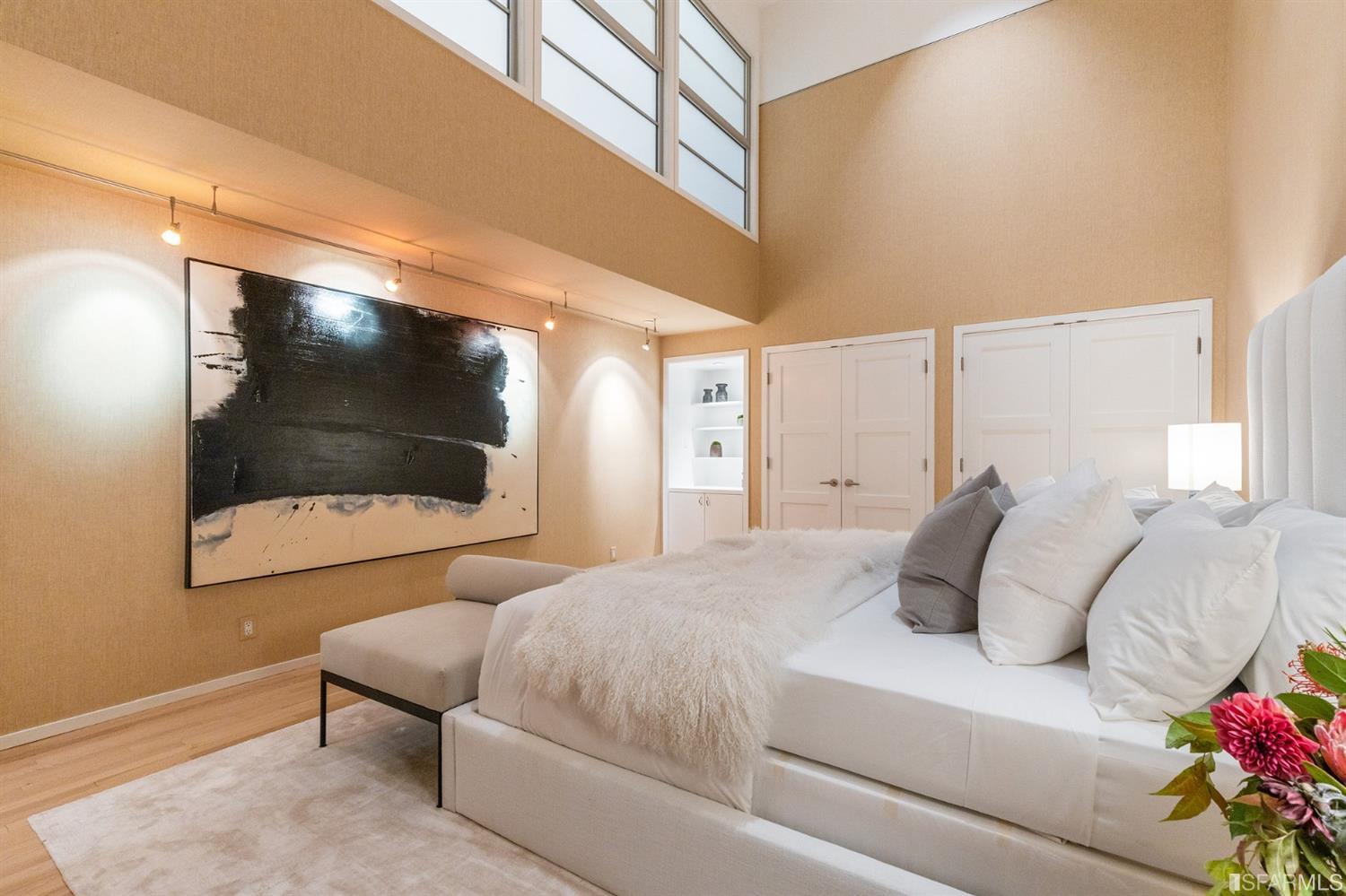 2 Fallon Place, Unit 15 San Francisco, CA 94133 - Photo 34 of 43 a bedroom with a bed and a flat screen tv