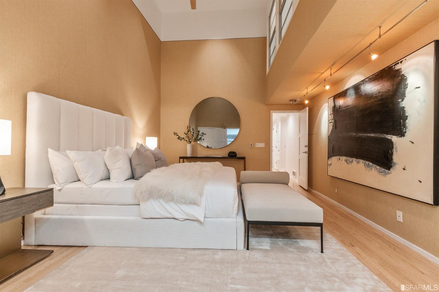 2 Fallon Place, Unit 15 San Francisco, CA 94133 - Photo 36 of 43 a bedroom with a bed and a mirror