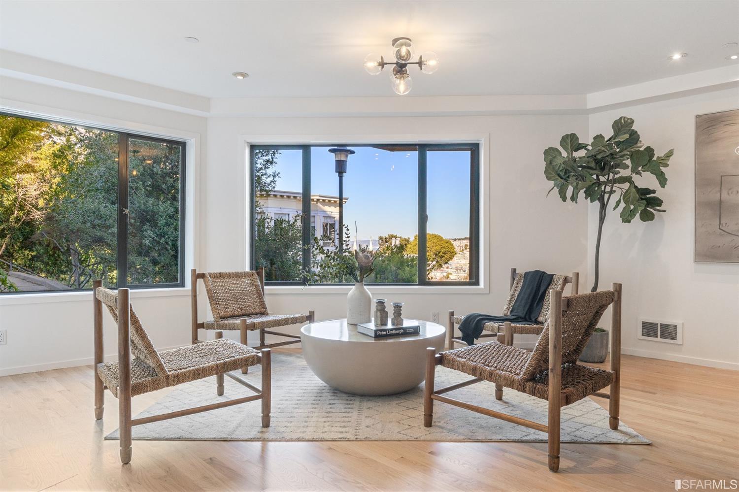 2 Fallon Place, Unit 15 San Francisco, CA 94133 - Photo 5 of 43 a living room with furniture and a potted plant