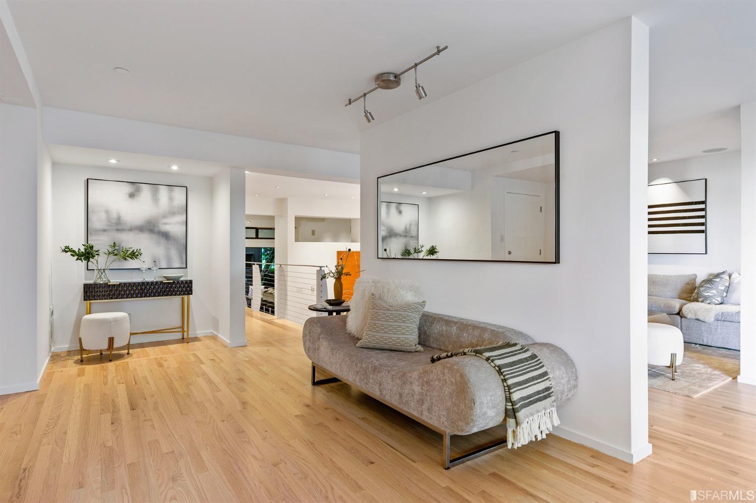 2 Fallon Place, Unit 15 San Francisco, CA 94133 - Photo 9 of 43 a living room with furniture and a wooden floor