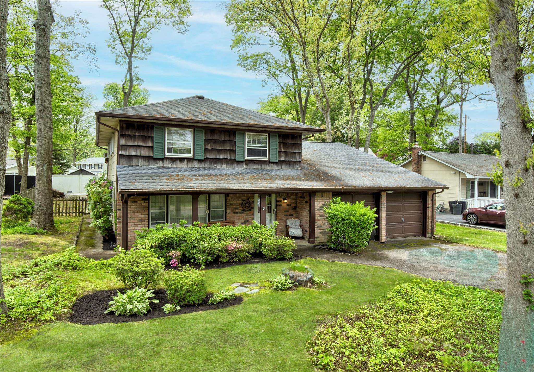 a front view of a house with garden