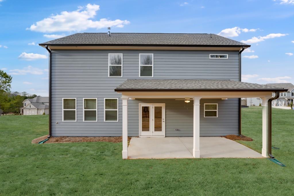 1011 Reagan Drive Madison, GA 30650 - Photo 40 of 40 a front view of a house with a garden