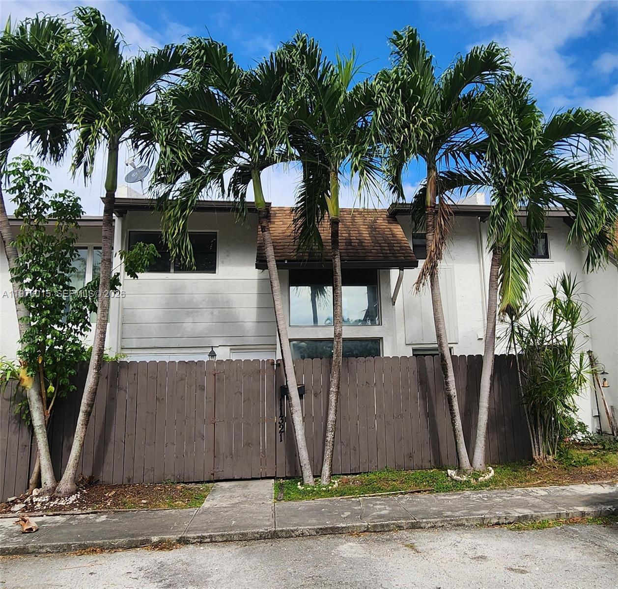 11321 Southwest 65th Street Miami, FL 33173 - Photo 1 of 24 a front view of a house with garden