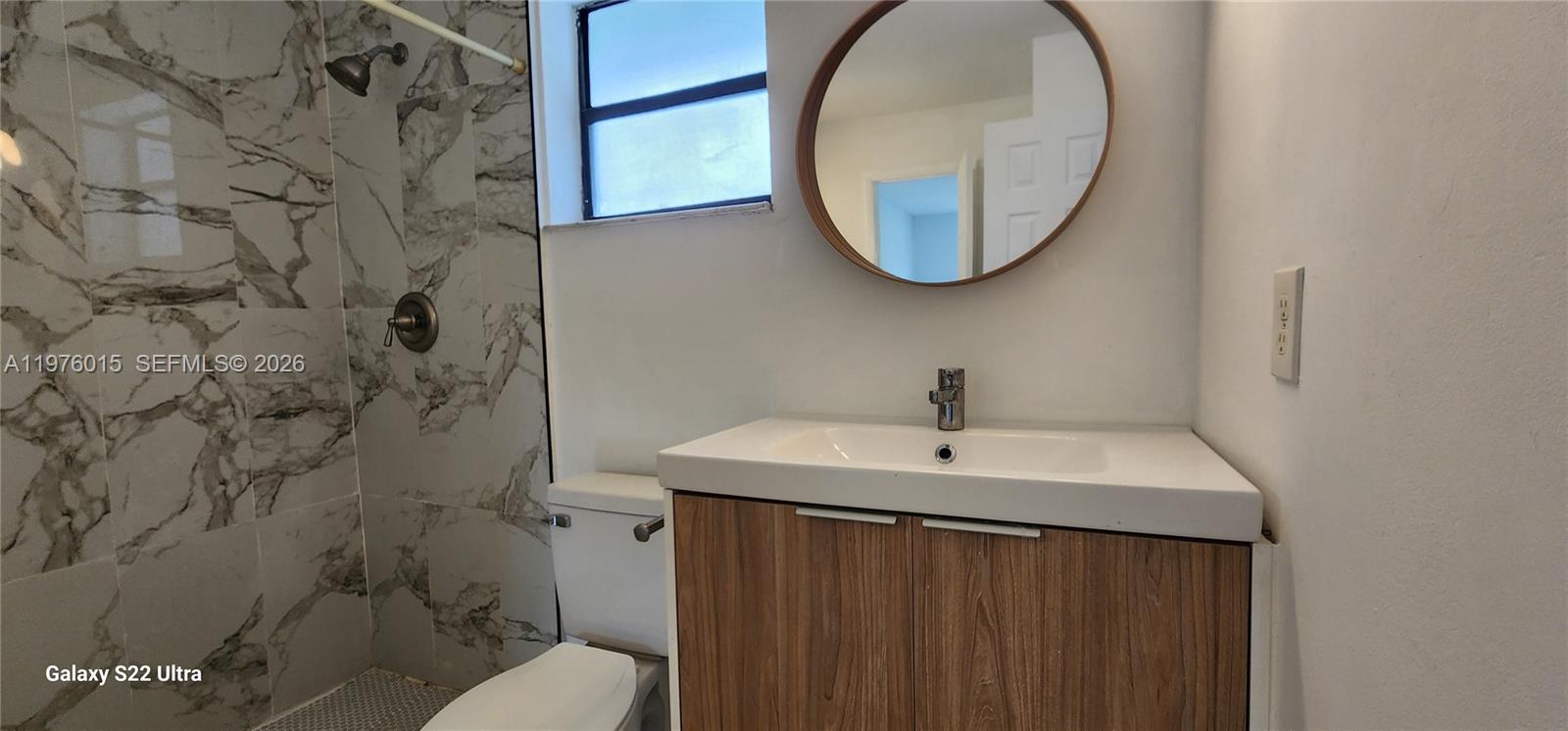 11321 Southwest 65th Street Miami, FL 33173 - Photo 13 of 24 a bathroom with a sink and a mirror