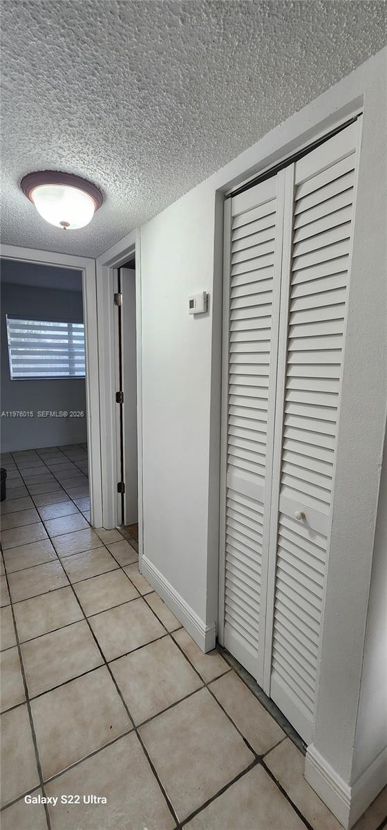 11321 Southwest 65th Street Miami, FL 33173 - Photo 14 of 24 a view of a closet area with living room