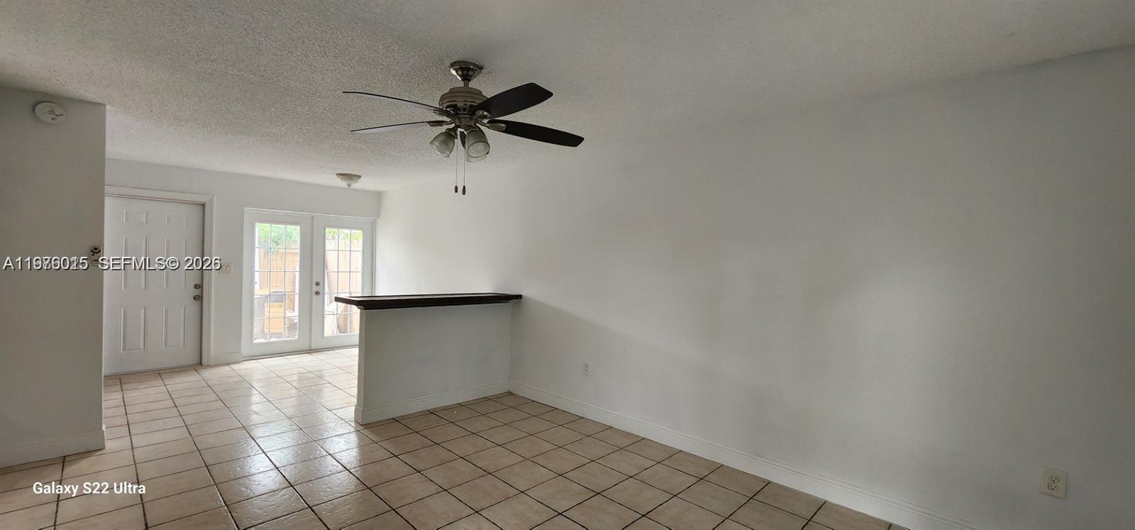 11321 Southwest 65th Street Miami, FL 33173 - Photo 15 of 24 a view of empty room with wooden floor