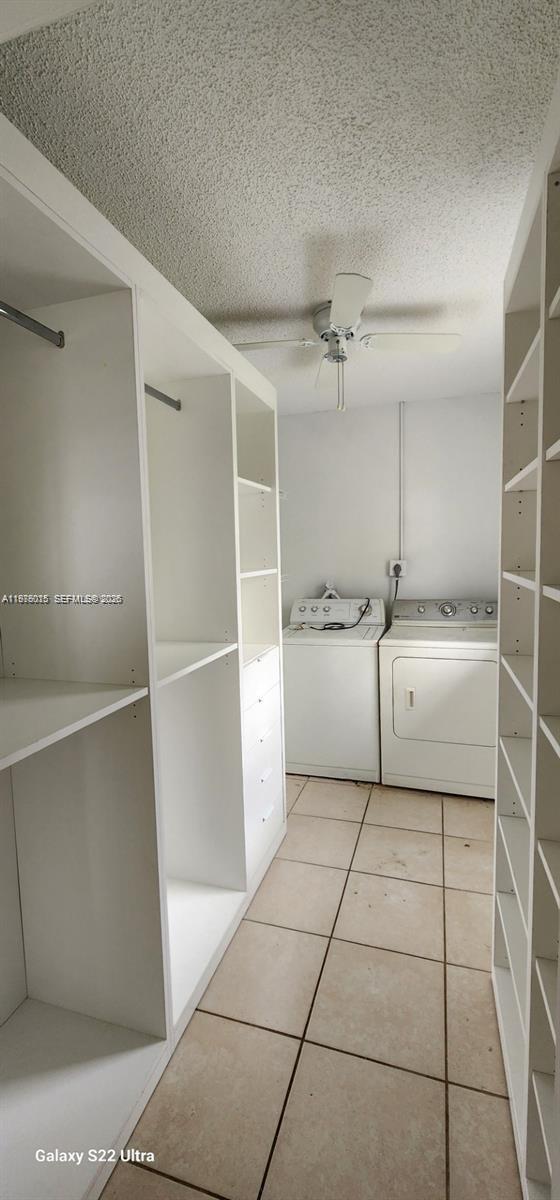 11321 Southwest 65th Street Miami, FL 33173 - Photo 18 of 24 a utility room with cabinets washer and dryer
