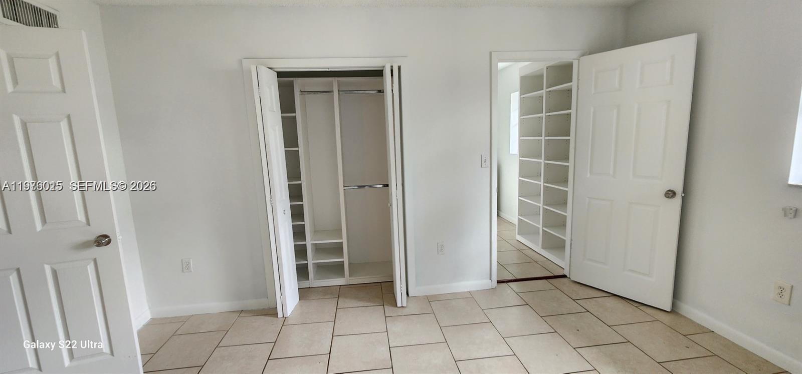 11321 Southwest 65th Street Miami, FL 33173 - Photo 20 of 24 an empty room with windows