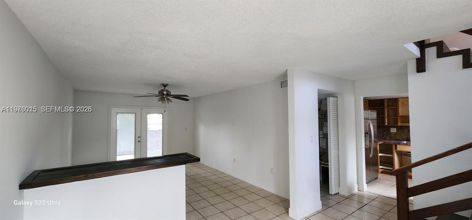 11321 Southwest 65th Street Miami, FL 33173 - Photo 22 of 24 a view of a hallway with wooden floor and staircase