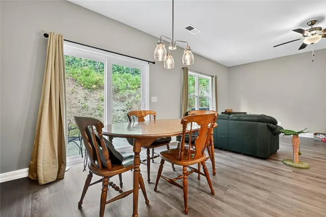 a view of a dining room with furniture window and wooden floor
