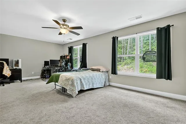 a bed room with a bed and a window