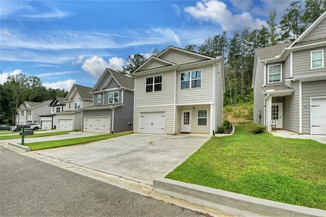 a front view of a house with a yard