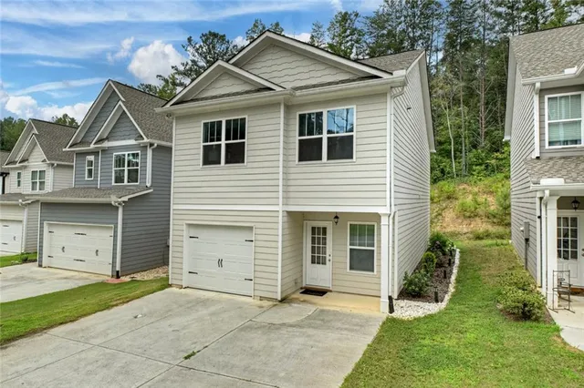 front view of a house with a yard
