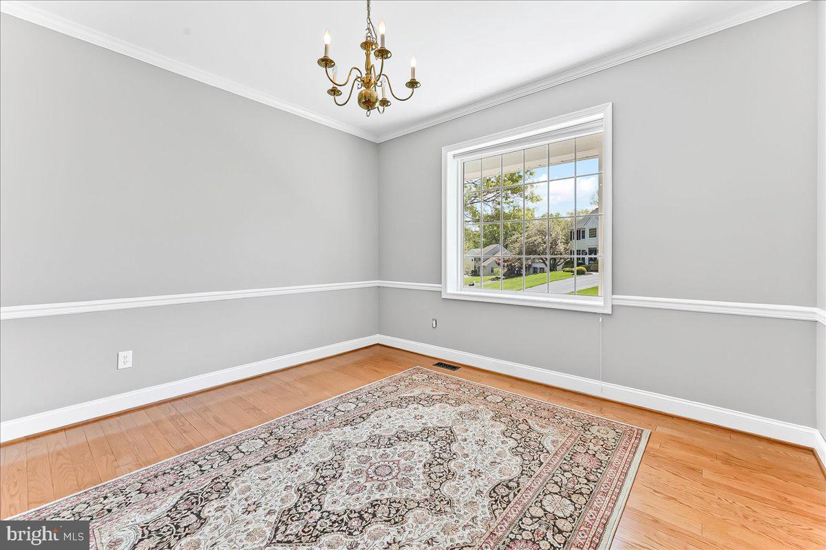 233 Chaingate Circle Landenberg, PA 19350 - Photo 11 of 31 a view of an empty room with a window and wooden floor