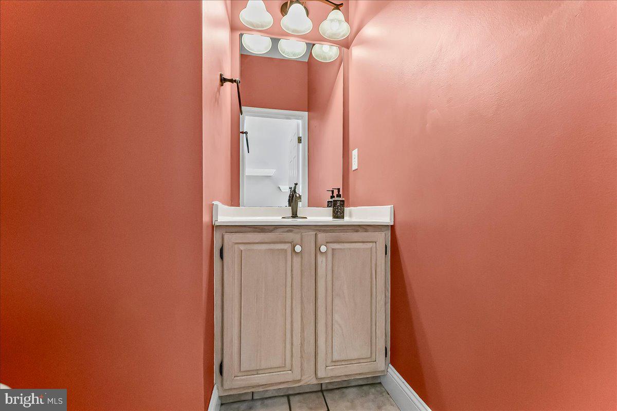 233 Chaingate Circle Landenberg, PA 19350 - Photo 15 of 31 a bathroom with a sink and a mirror