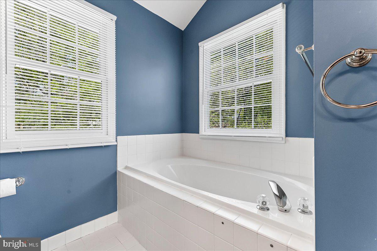 233 Chaingate Circle Landenberg, PA 19350 - Photo 18 of 31 a bath tub sitting in a bathroom next to a window