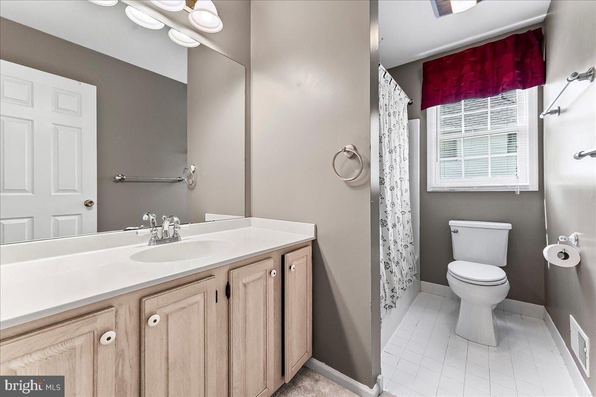 233 Chaingate Circle Landenberg, PA 19350 - Photo 22 of 31 a bathroom with a sink a toilet and a mirror