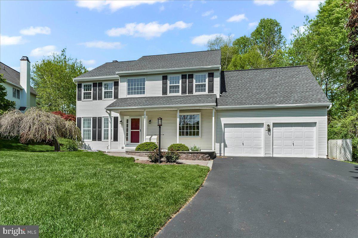 233 Chaingate Circle Landenberg, PA 19350 - Photo 28 of 31 a front view of a house with a garden and trees