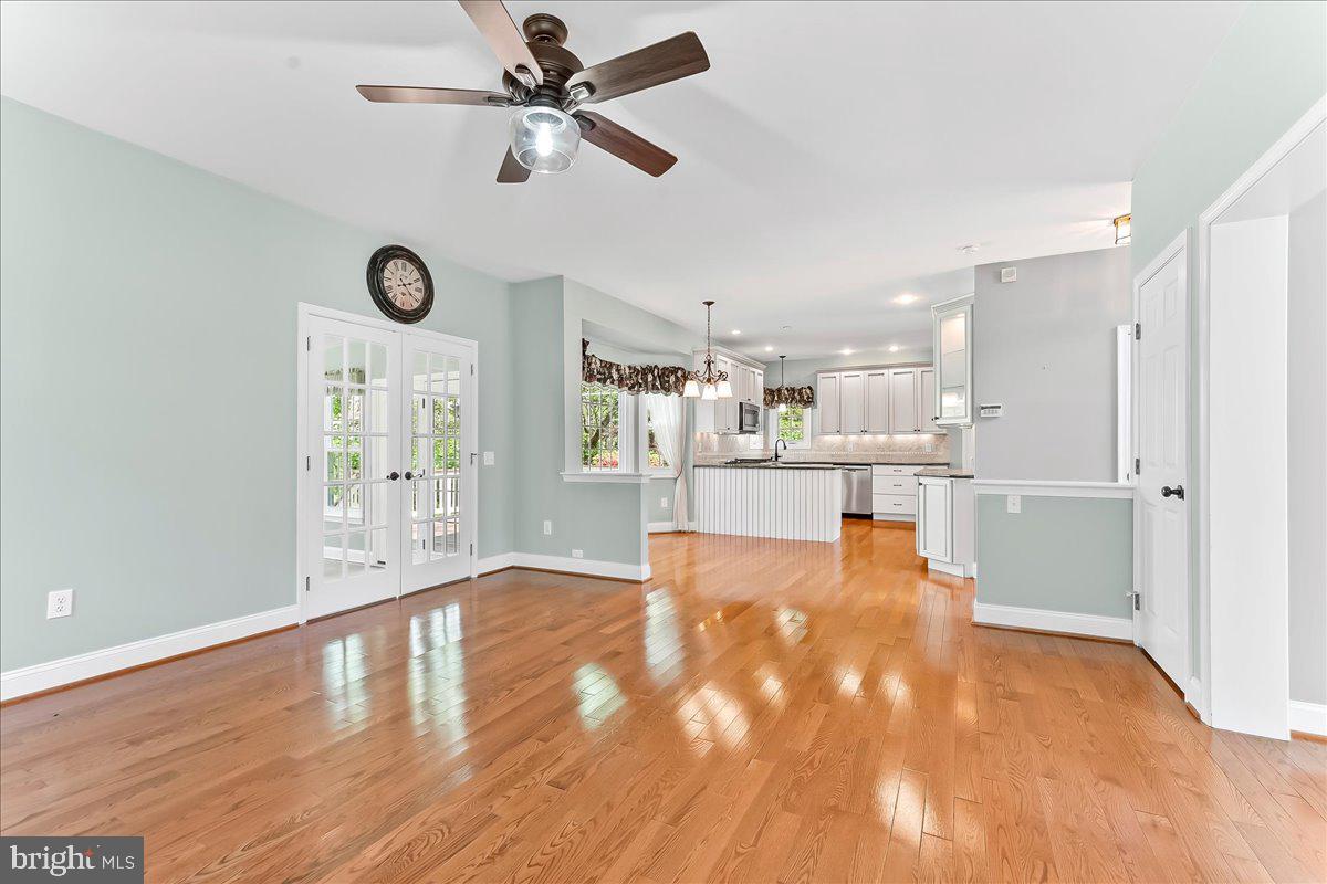 233 Chaingate Circle Landenberg, PA 19350 - Photo 6 of 31 a view of a kitchen with wooden floor and a ceiling fan