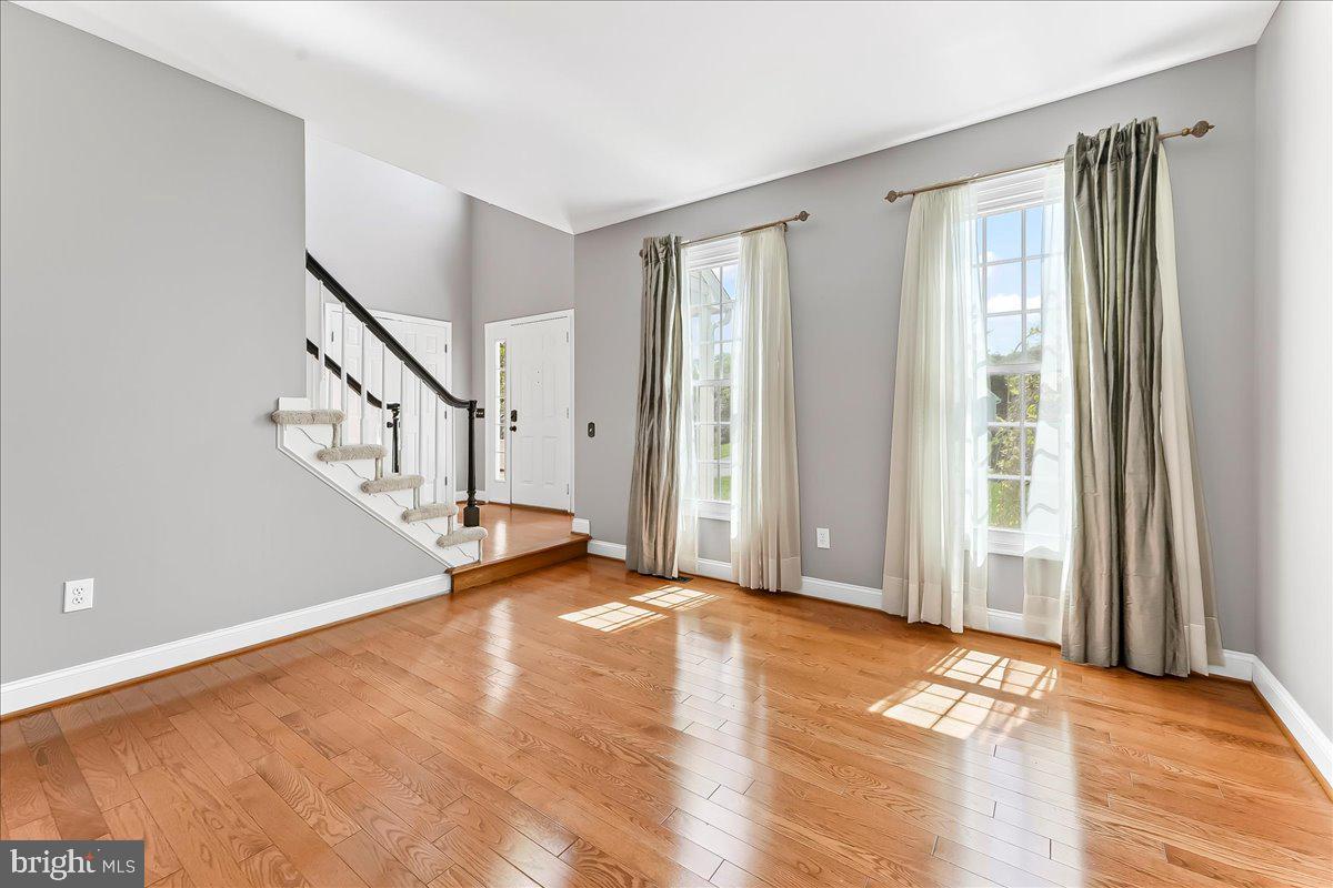 233 Chaingate Circle Landenberg, PA 19350 - Photo 10 of 31 a view of an empty room with wooden floor and a window