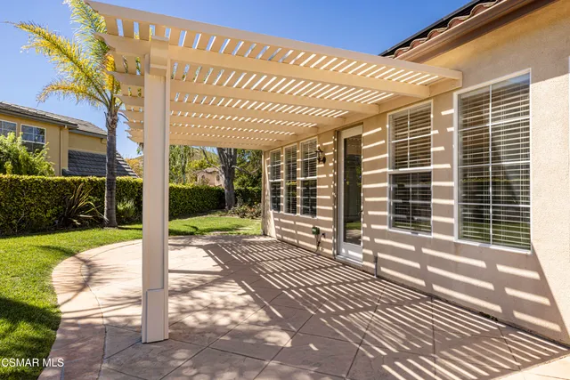 a view of a porch with wooden floor and fence