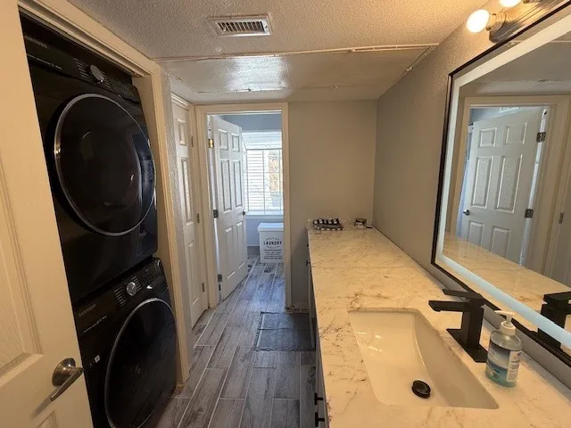 a view of a storage and utility room with washer and dryer