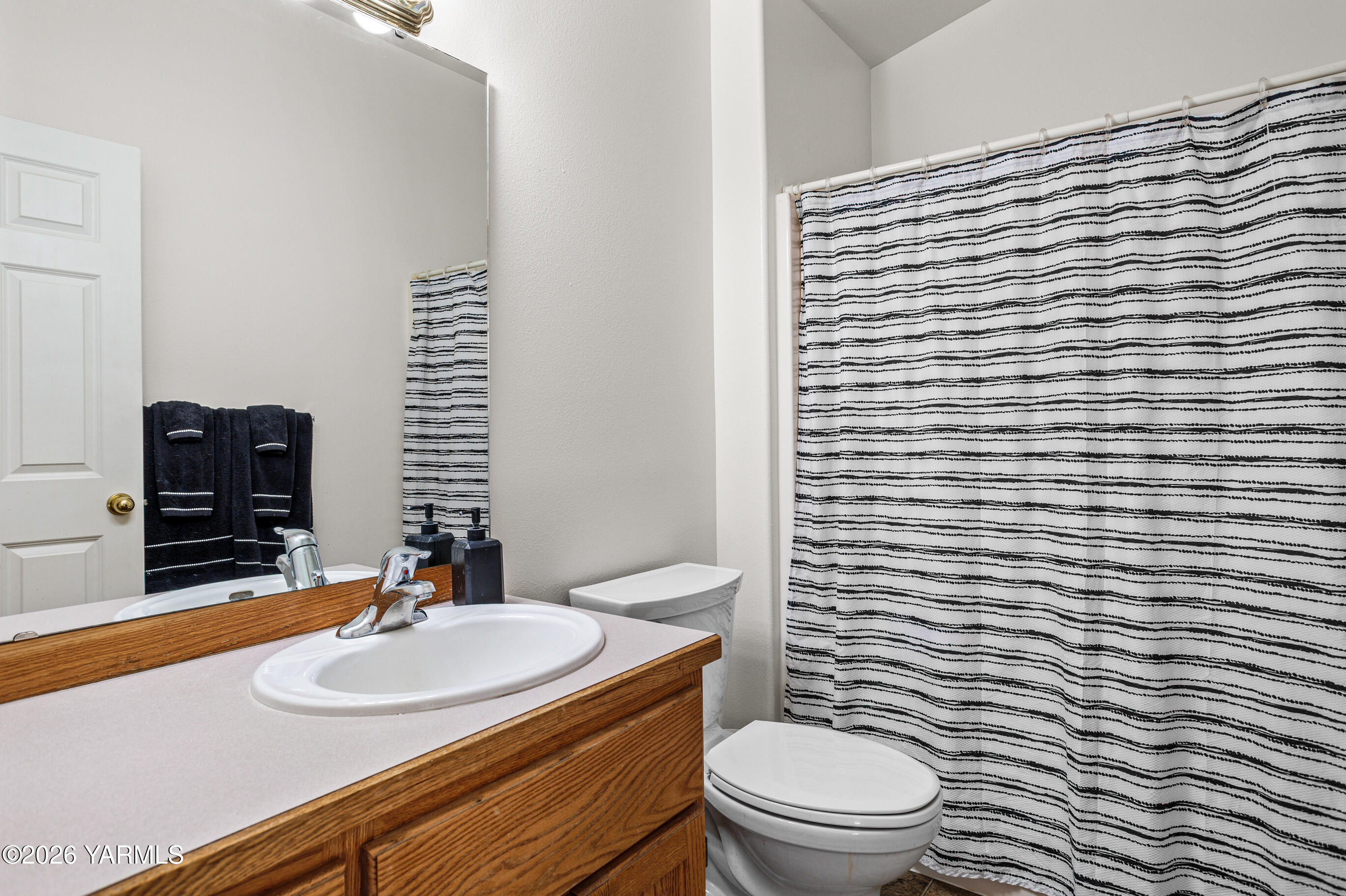 5060 Lombard Loop Road Zillah, WA 98953 - Photo 44 of 65 a bathroom with a sink a toilet and mirror