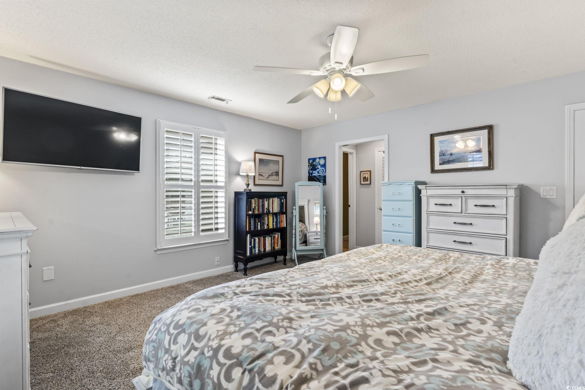 1671 Arundel Road Myrtle Beach, SC 29577 - Photo 11 of 40 Bedroom with a textured ceiling, carpet flooring,