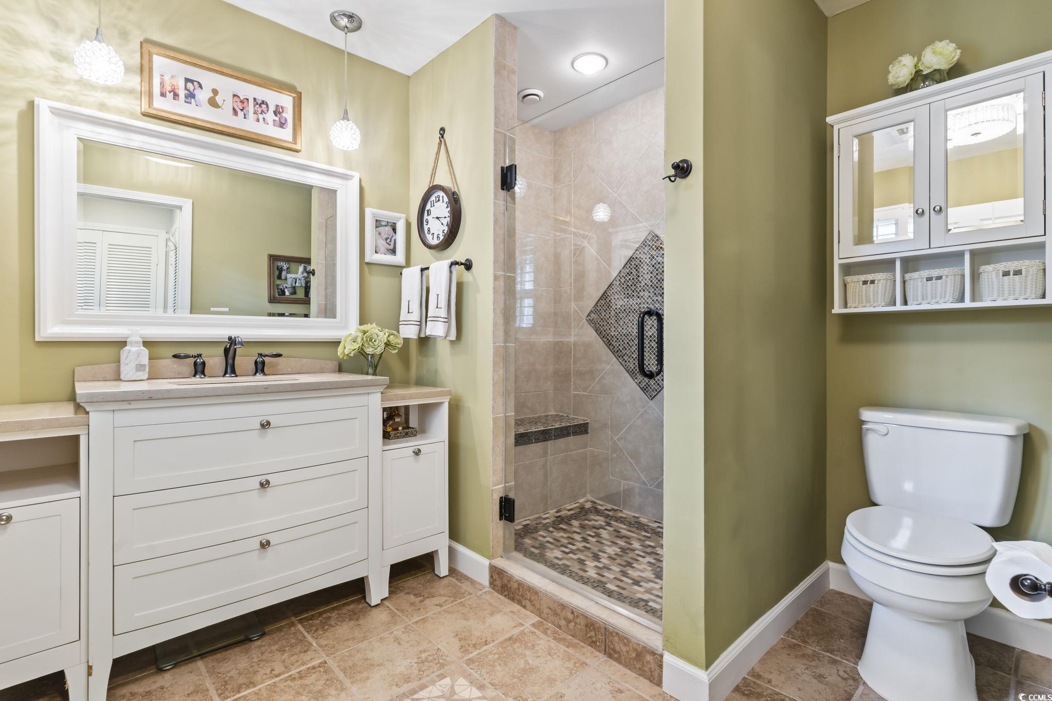 1671 Arundel Road Myrtle Beach, SC 29577 - Photo 13 of 40 Bathroom featuring a shower with door, toilet, and