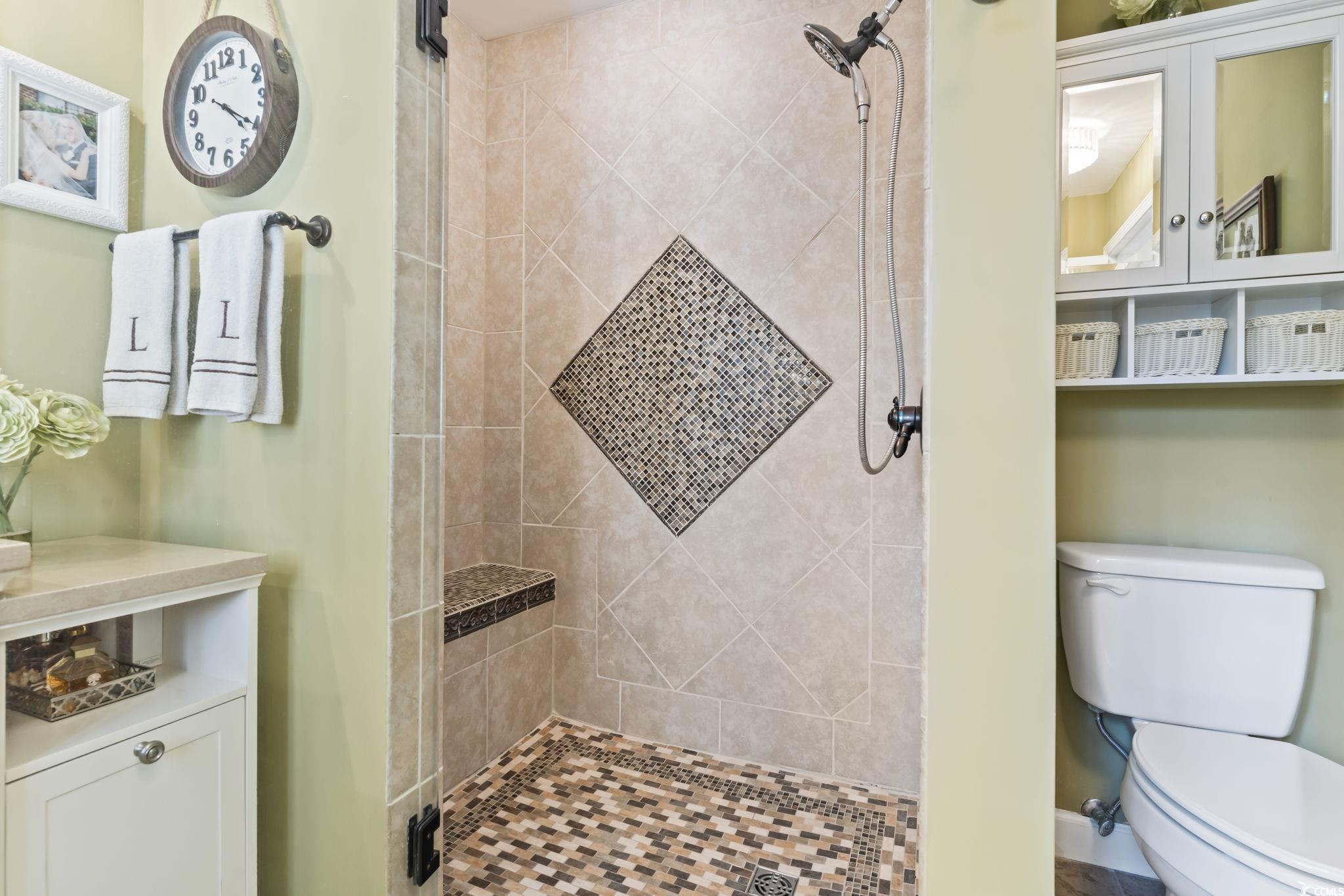 1671 Arundel Road Myrtle Beach, SC 29577 - Photo 15 of 40 Bathroom featuring toilet and a tile shower