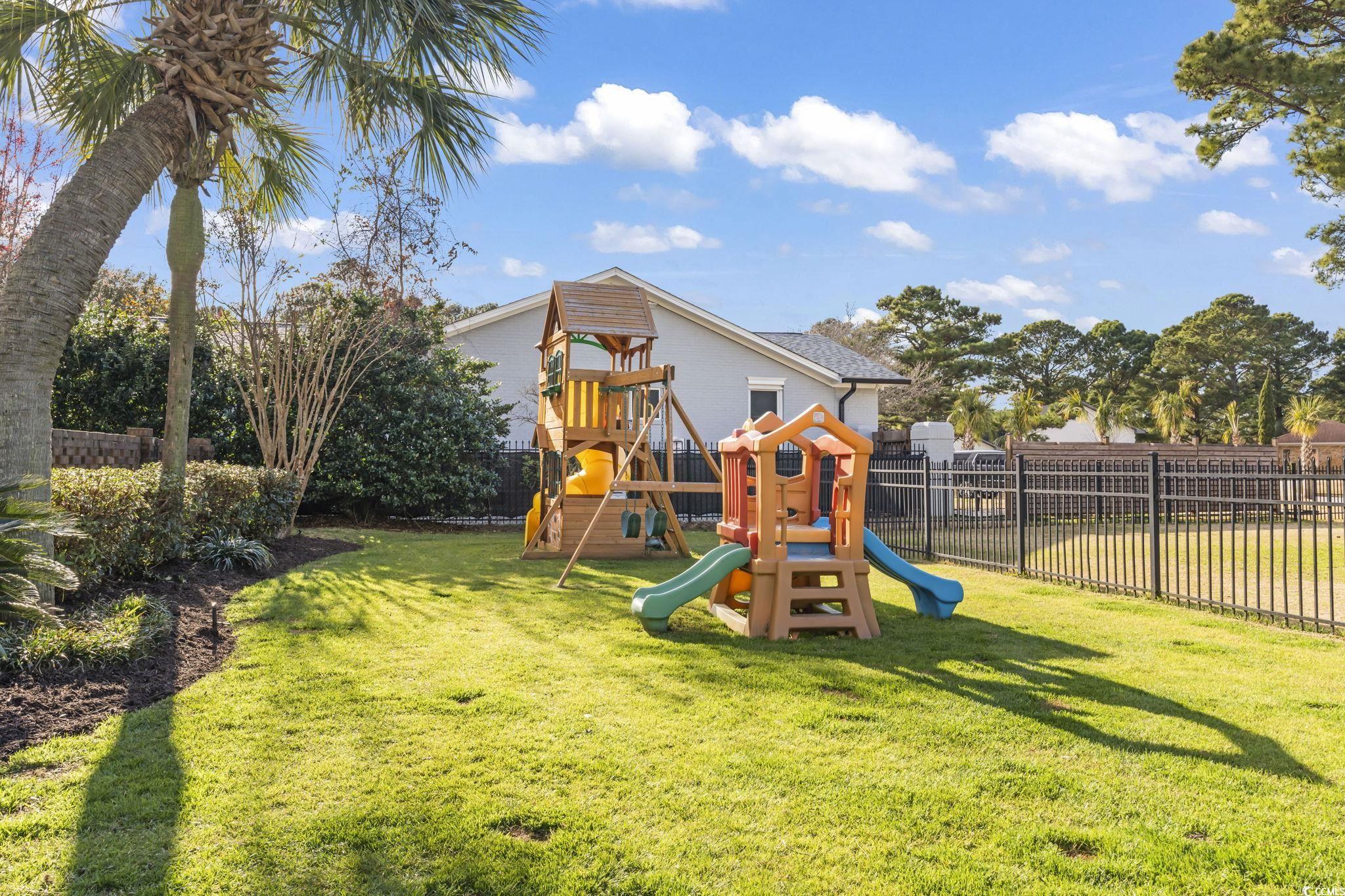 1671 Arundel Road Myrtle Beach, SC 29577 - Photo 29 of 40 View of playground with a lawn