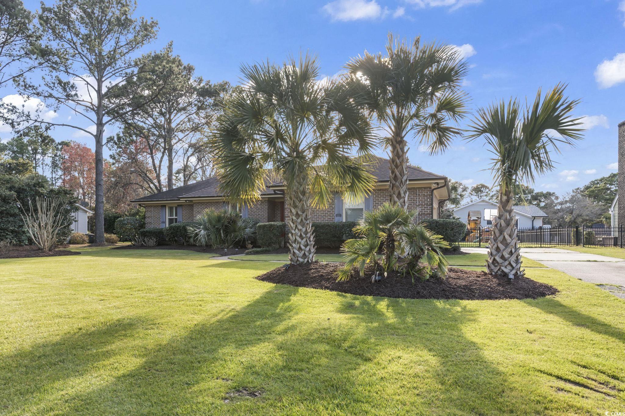 1671 Arundel Road Myrtle Beach, SC 29577 - Photo 3 of 40 View of front of house featuring a front lawn