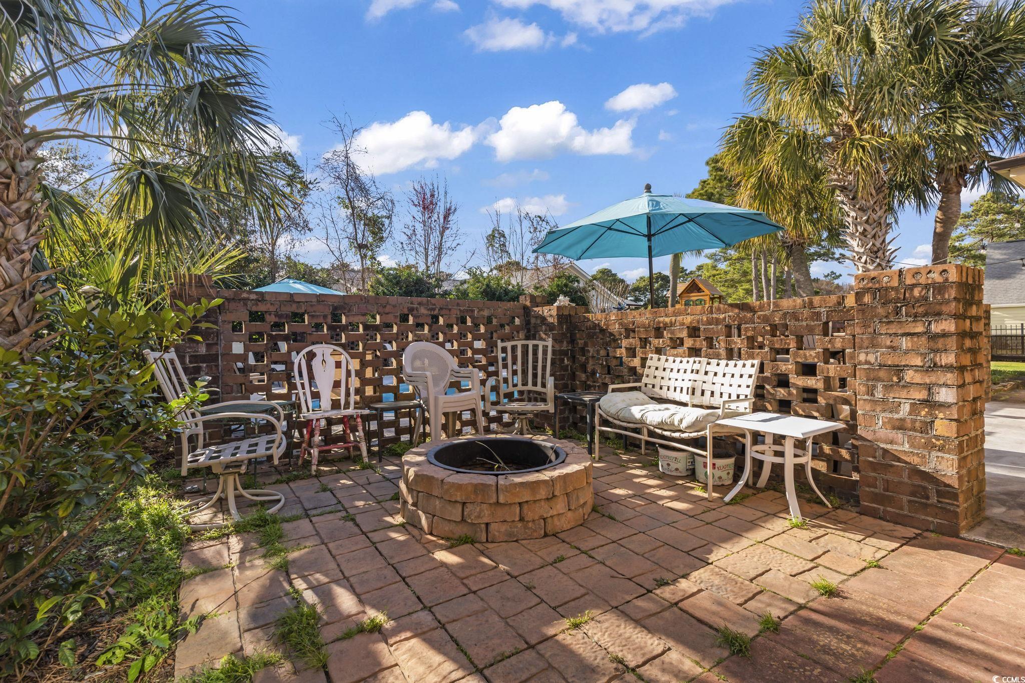 1671 Arundel Road Myrtle Beach, SC 29577 - Photo 31 of 40 View of patio / terrace featuring an outdoor fire