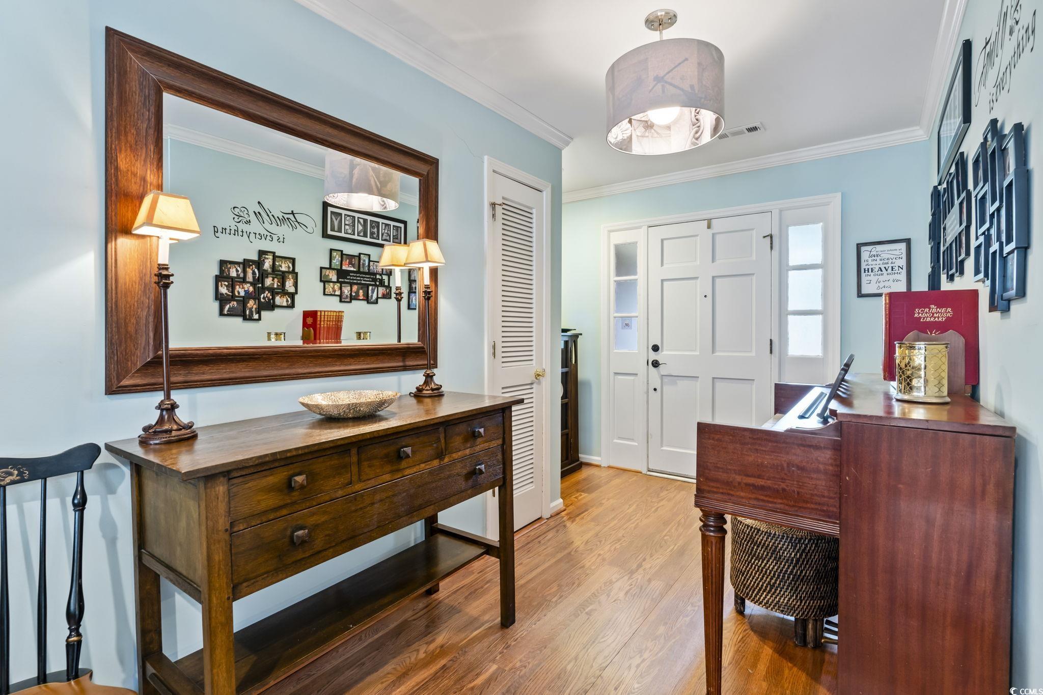 1671 Arundel Road Myrtle Beach, SC 29577 - Photo 5 of 40 Entrance foyer featuring crown molding and hardwoo