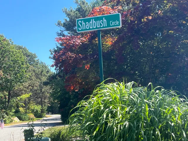 a sign that is on a brick wall