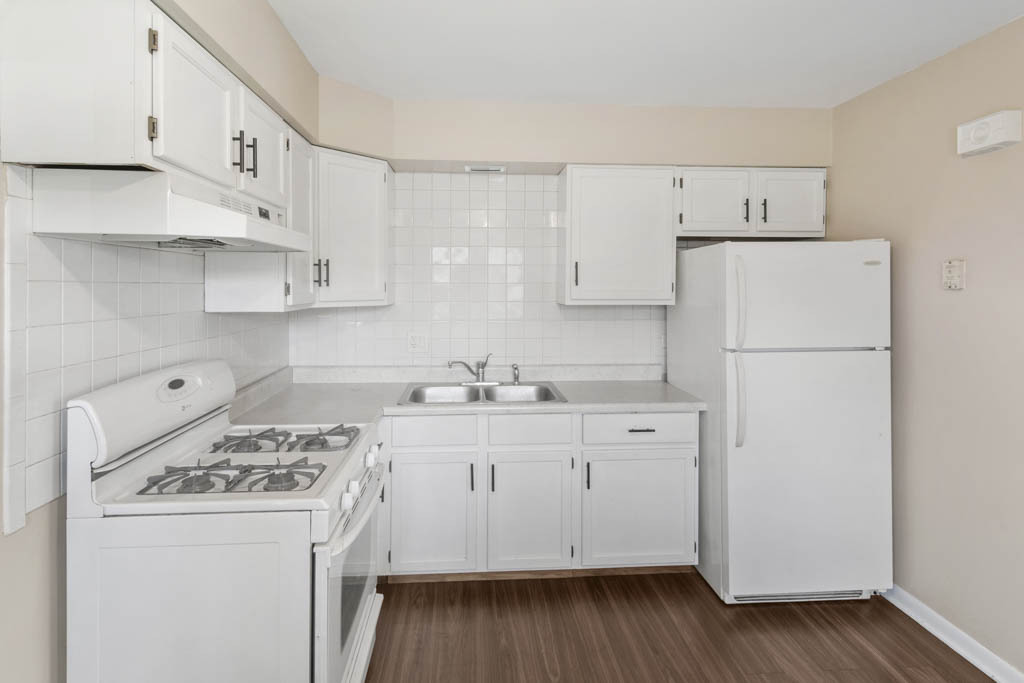11212 1st Street, Unit 1 Mokena, IL 60448 - Photo 2 of 10 a kitchen with a white cabinets and white appliances