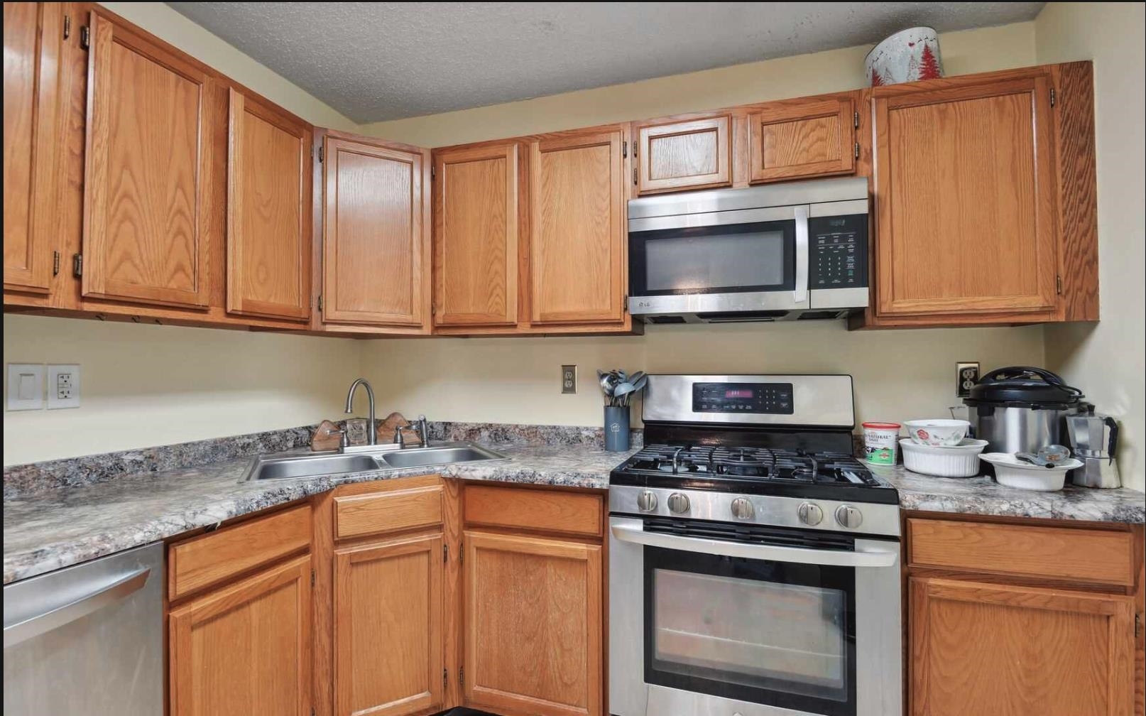 1272 Paddington Road Mahwah, NJ 07430 - Photo 5 of 15 a kitchen with granite countertop cabinets stainless steel appliances and a sink