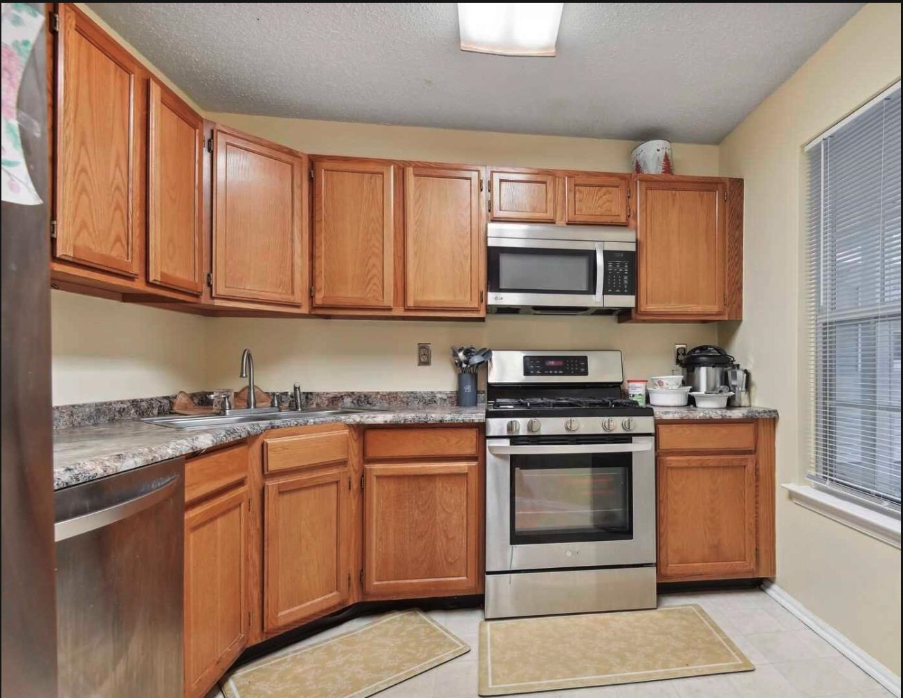 1272 Paddington Road Mahwah, NJ 07430 - Photo 6 of 15 a kitchen with stainless steel appliances granite countertop a stove microwave and cabinets